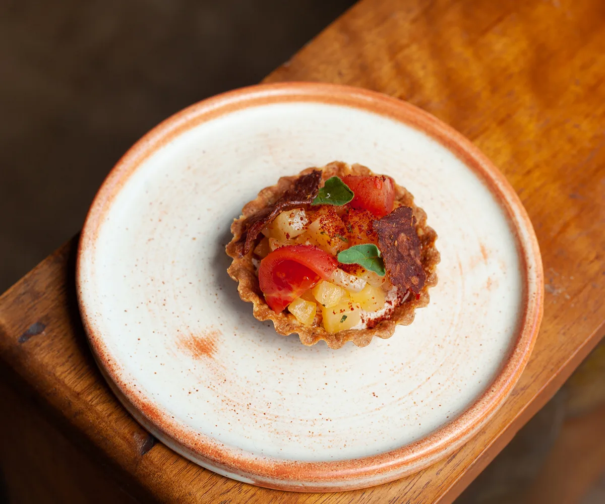 Pilot restaurant in Canberra, ACT "Hawaiian tart of 'nduja cream, fermented pineapple, tomatoes and crisp salami in a peppery pastry shell.