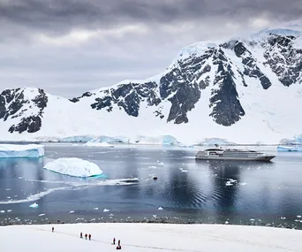 Hikers' view of Ponant's *Le Soléal* anchored off Danco Island.