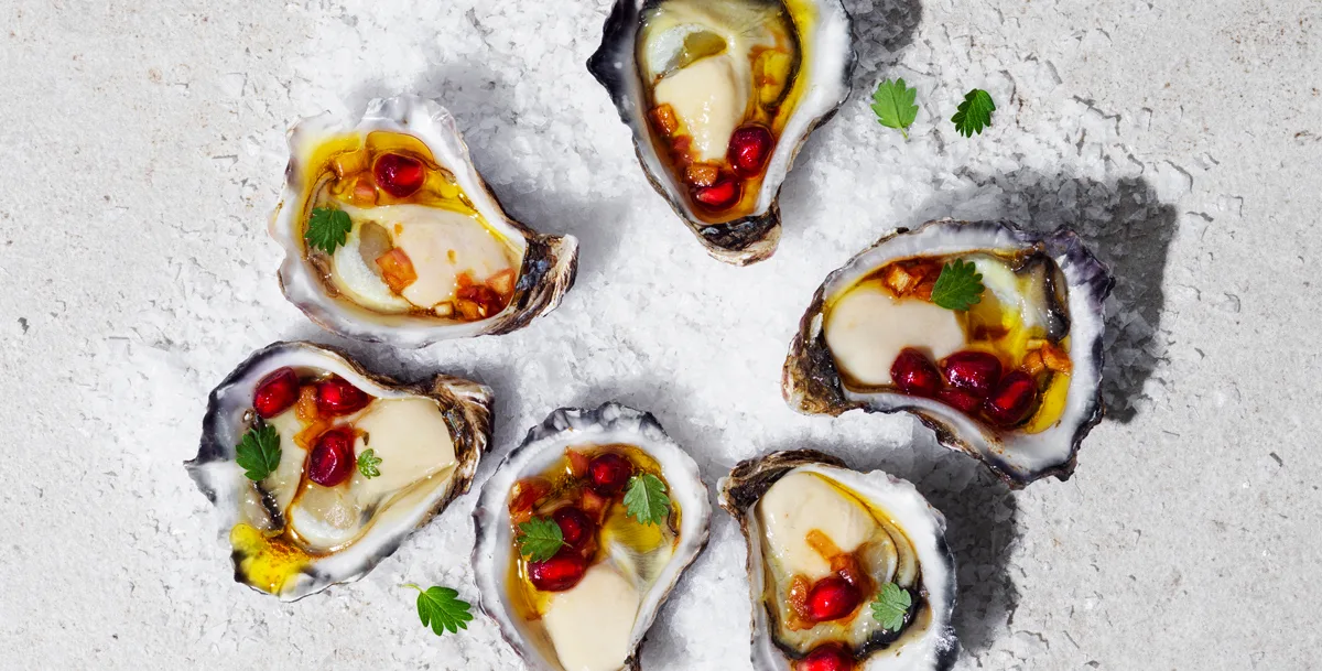 Oysters with pomegranate dressing recipe | Gourmet Traveller