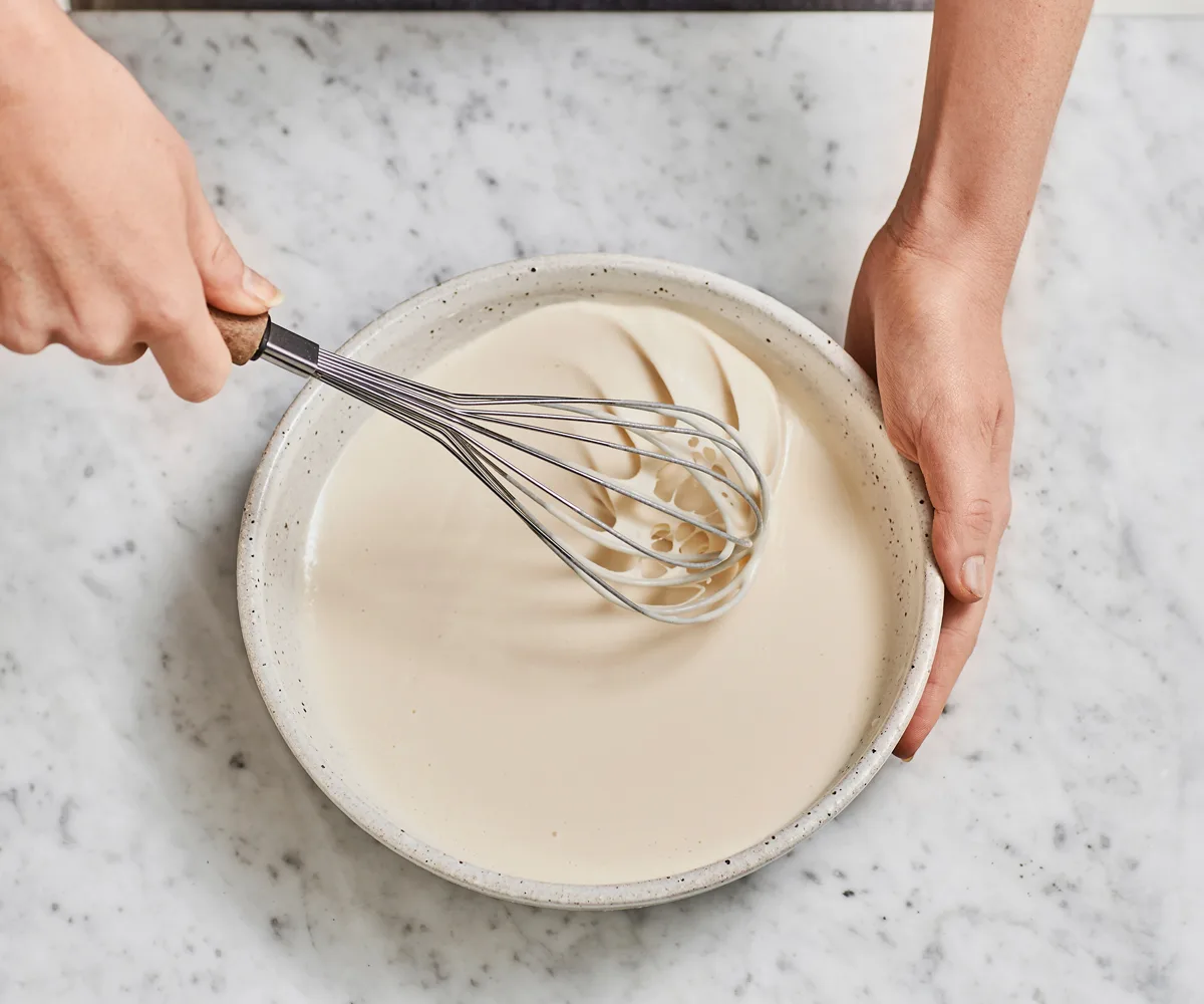 Whisking the batter to aerate and combine