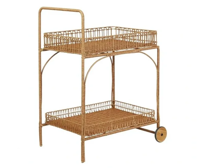 A wicker two-tier bar cart with a handle and wheels, featuring intricate weaving and an open design.
