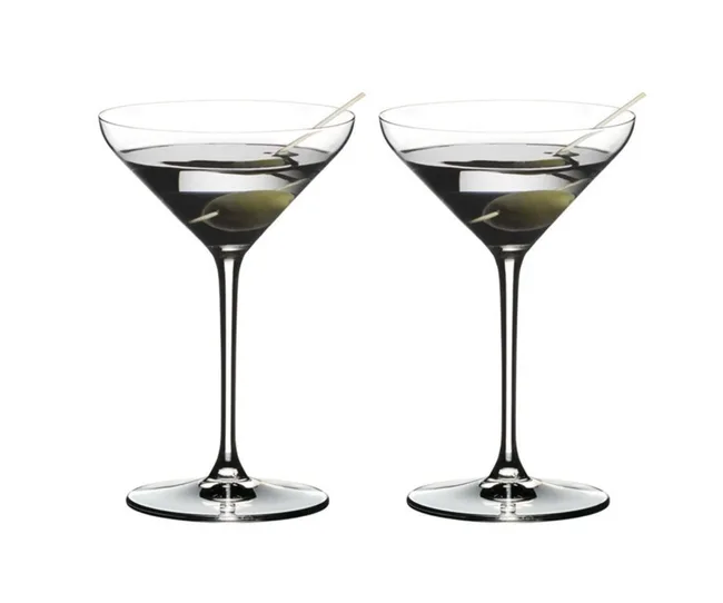 Two martini glasses, each with a green olive on a toothpick.