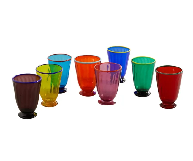 A set of eight colorful drinking glasses in various vibrant shades arranged in two rows.