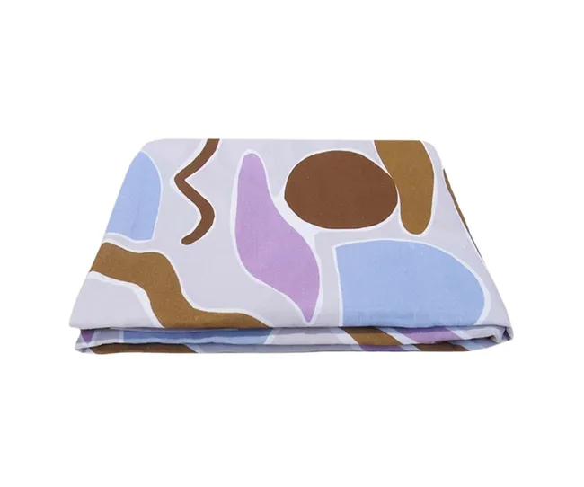 Folded, multicolored blanket with abstract shapes in brown, blue, and purple on a light background.