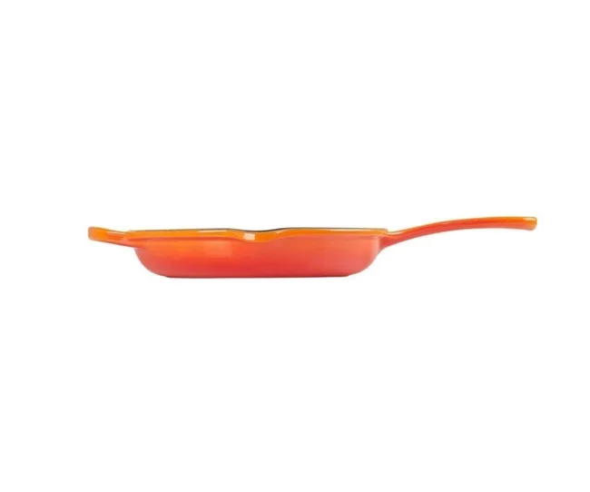 Orange cast iron skillet with a side handle and a sleek design.