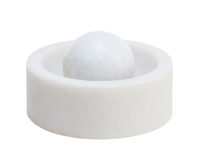 White marble mortar with a spherical pestle on a plain background.