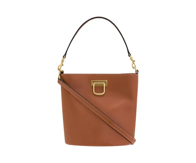 Brown leather bucket bag with gold hardware, shoulder strap, and top handle against a white background.