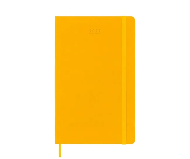 Yellow 2023 notebook with a textured cover and elastic band closure.