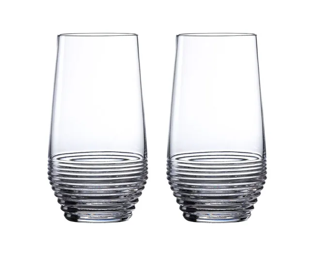 Two tall, clear glasses with ribbed bases on a white background.