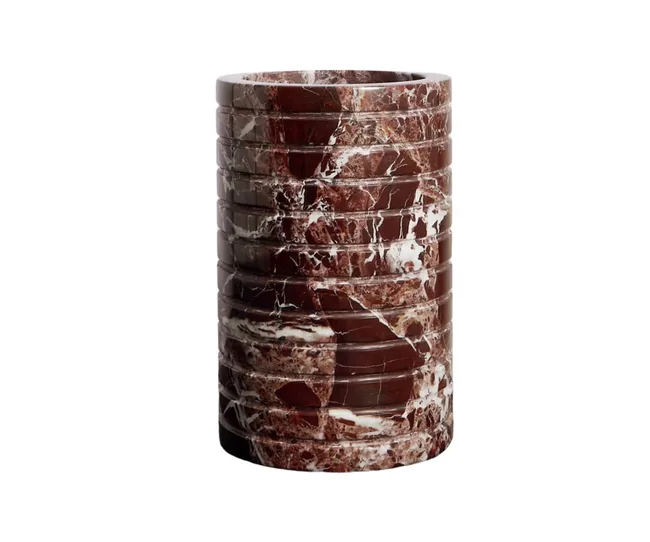 Brown marble cylindrical vase with horizontal grooves and white veining.