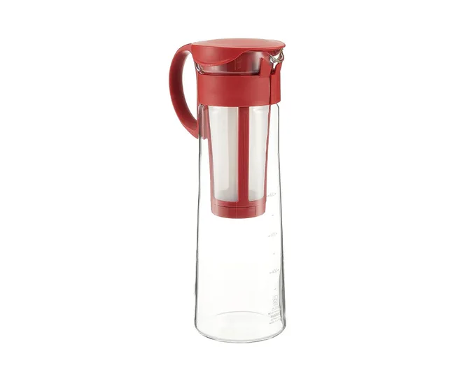 Red cold brew coffee maker with a lid and handle on a white background.
