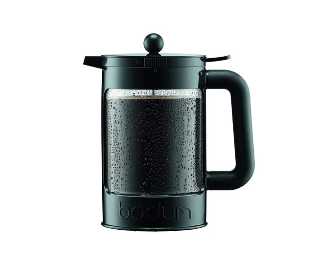 Black Bodum French press coffee maker with water droplets on the glass.