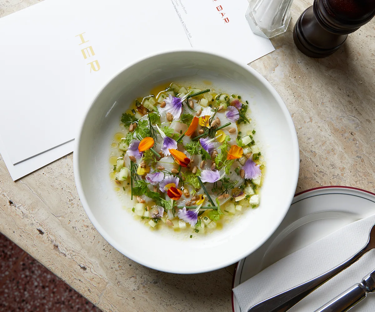 Her Bar in Melbourne, Victoria. Photo of the ceviche decorated with colourful edible flowers.