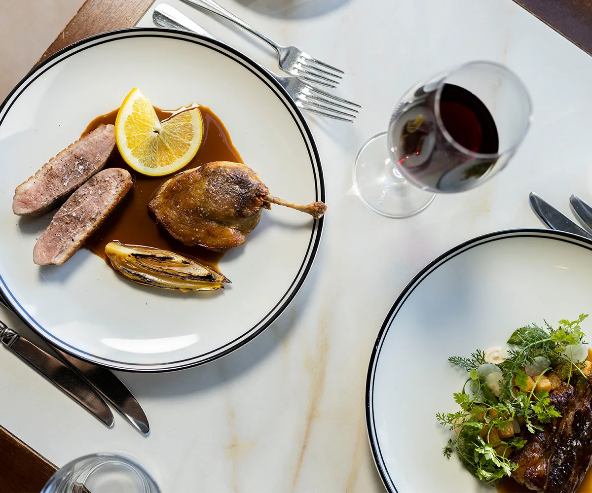 Market Bistro in Maroochydore, Sunshine Coast Queensland. Photo of red wine served with duck and a salad.
