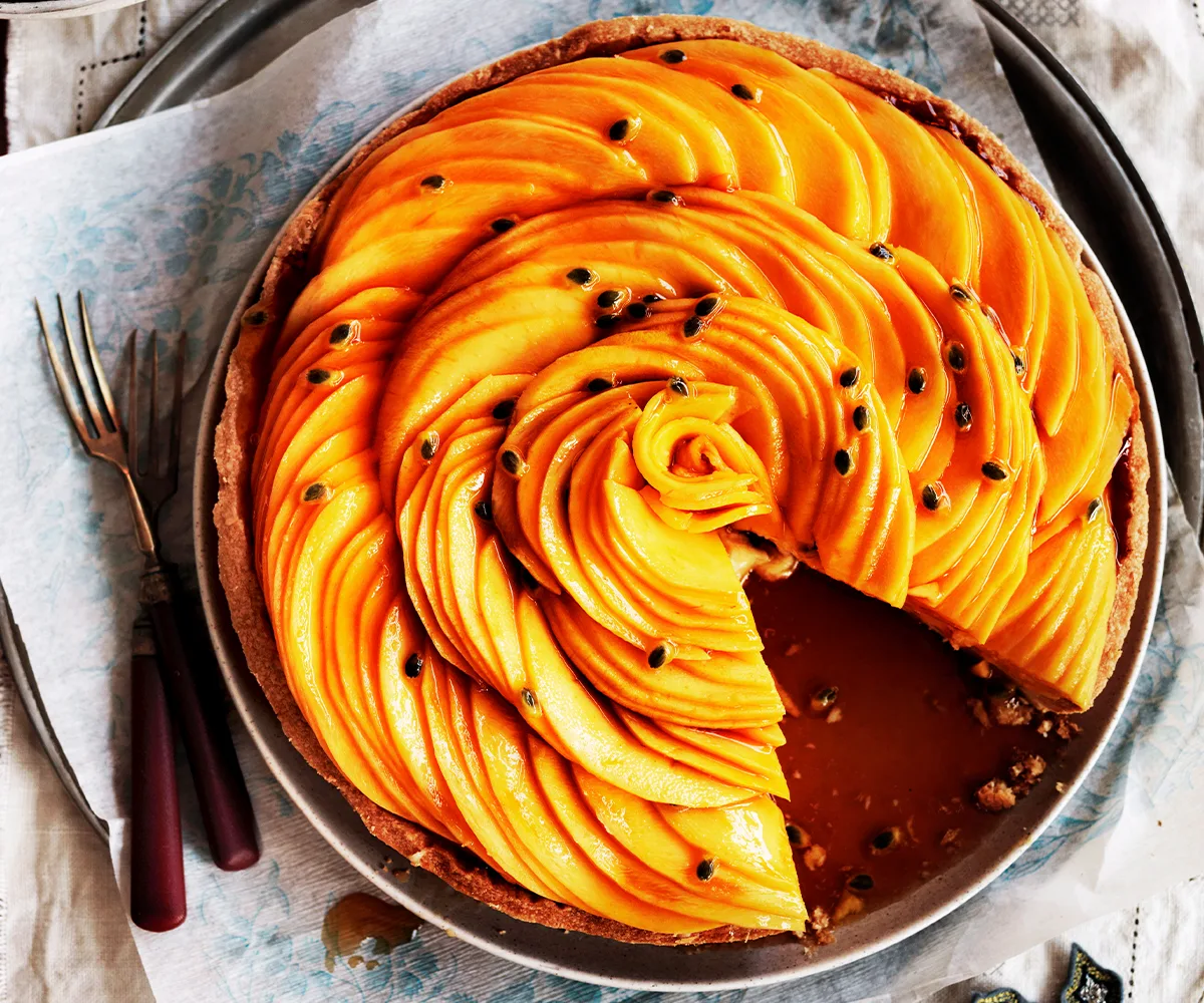 Photo of a golden mango and passionfruit caramel tart