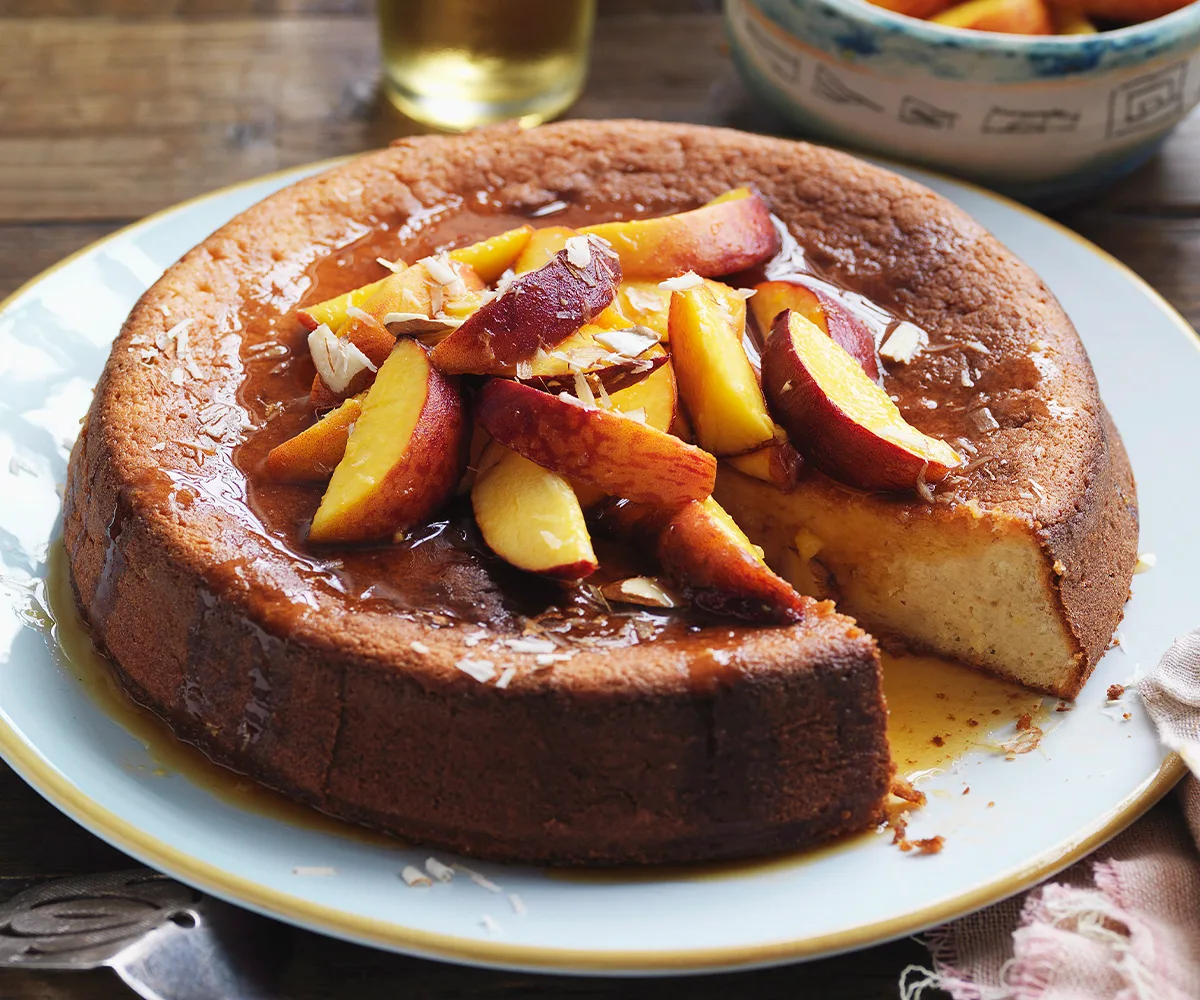 Yoghurt and almond cake with orange-caramel peaches and vanilla yoghurt