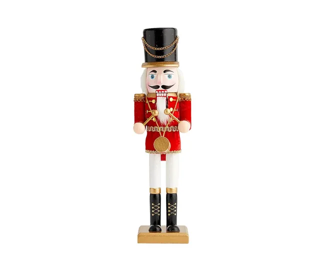 Nutcracker figurine in a red uniform with a black hat, white beard, and painted smile, standing on a wooden base.