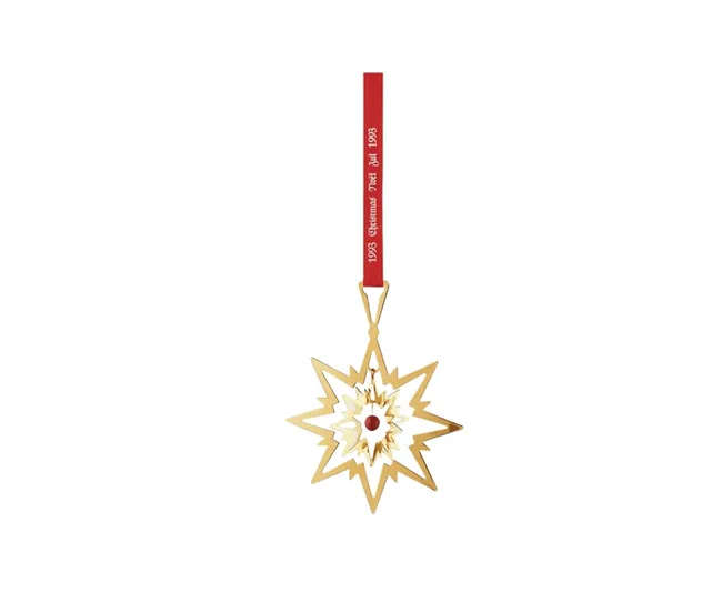 Gold star-shaped ornament with red ribbon reading "1993 Christmas Seal Jul 1993" and a red center detail.