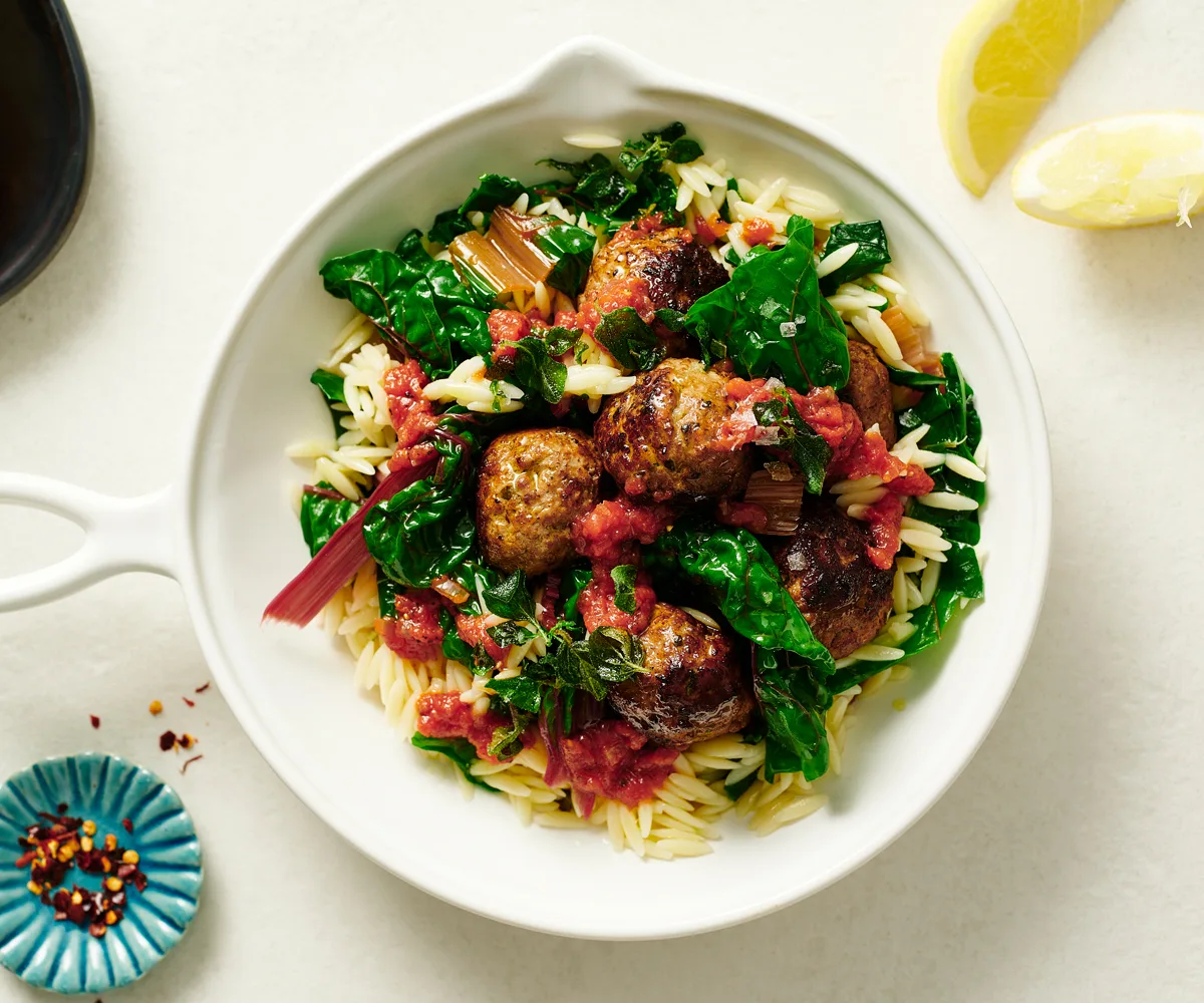 Greek lamb meatballs recipe with orzo, tomato-garlic sauce and fried oregano