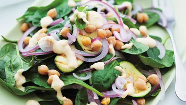 Spinach and zucchini salad with yoghurt hummus
