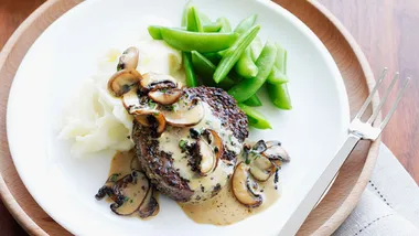 Pepper steaks with mushroom sauce and creamy mash