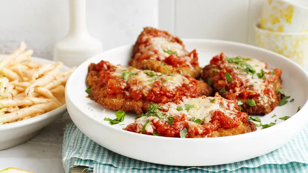 Veal parmigiana with buttered pasta spirals recipe
