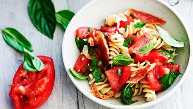 Pasta salad with tomato and crisp prosciutto