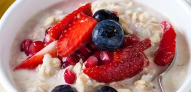 Coconut and apple bircher muesli with berry salsa