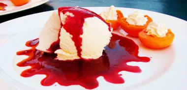 Ice cream with plum and cherry sauce
