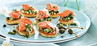 Wasabi pikelets and salmon with lime and cucumber salsa