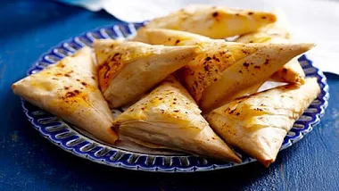 Cheese, tomato and olive triangles