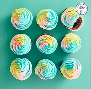 9 chocolate cupcakes with rainbow icing