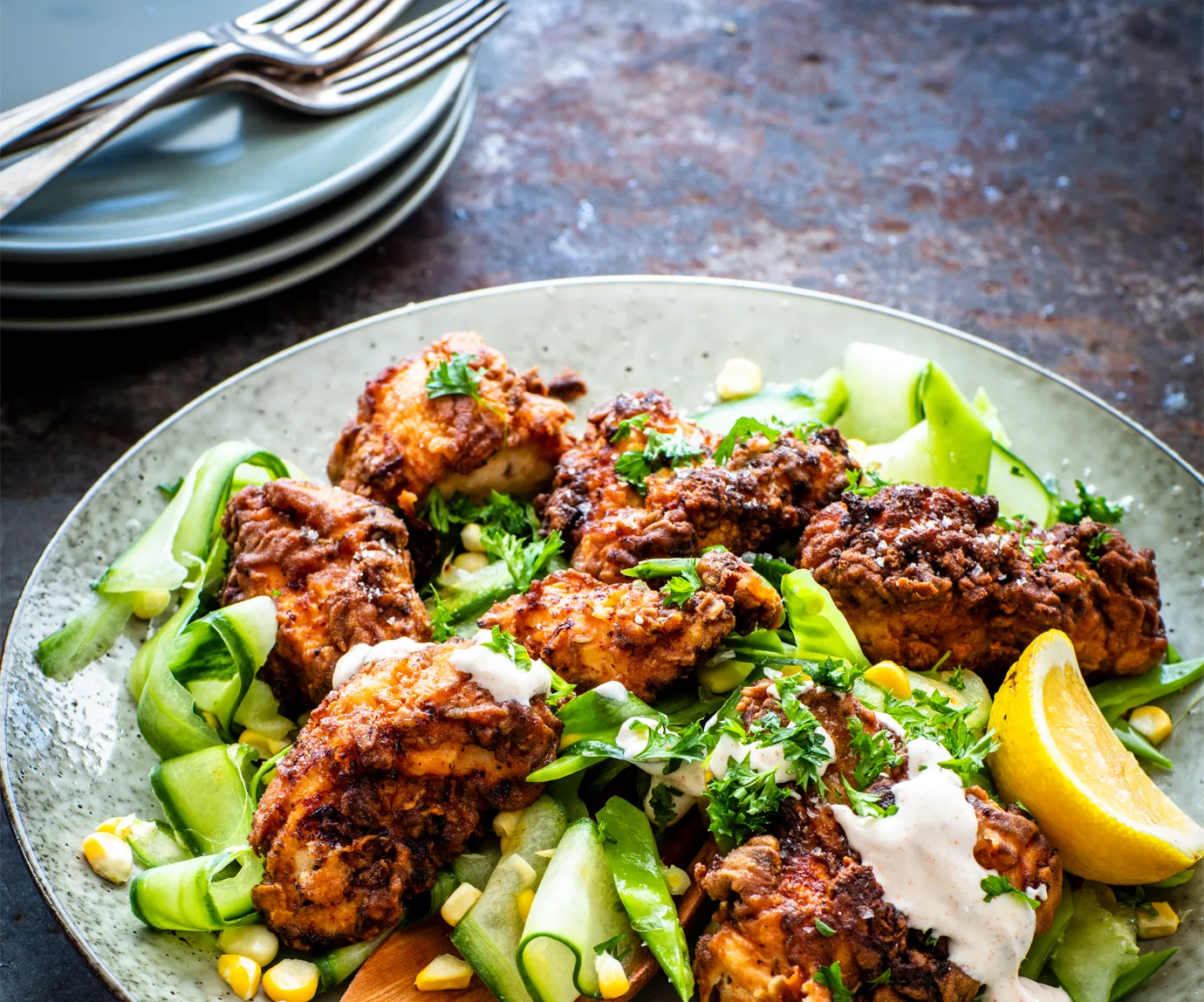 Crispy fried chicken with cucumber and corn salad