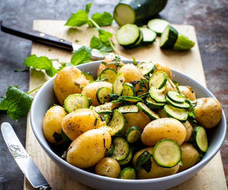 Buttery potatoes and minted courgettes