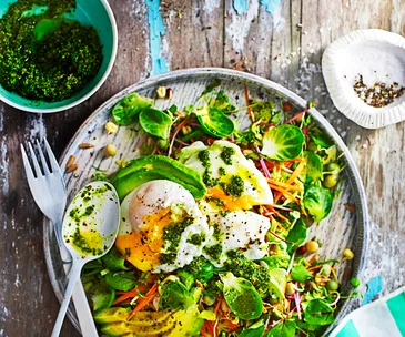 Breakfast salad with poached egg and kale pesto