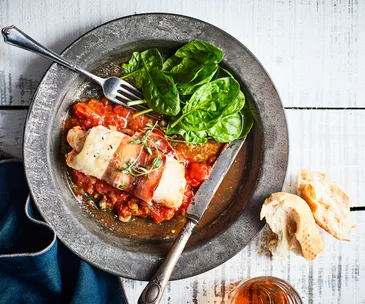 Hoki and prosciutto bundles with tomato and caper sauce