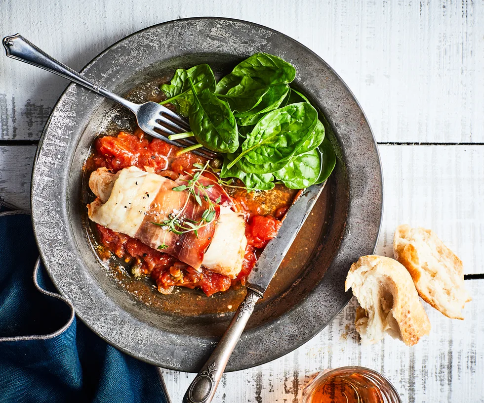 Hoki and prosciutto bundles with tomato and caper sauce