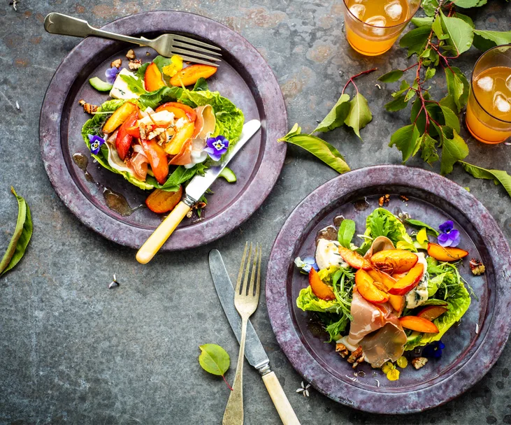 Warm nectarine salad with blue cheese, prosciutto and chilli pecans