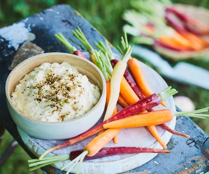 Fresh pineapple cheese dip with baby carrots