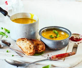 Creamy turmeric, basil and buttercup soup