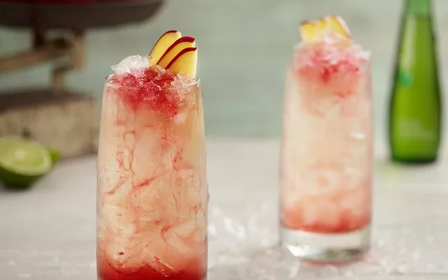 glass of non-alcoholic mocktail with apple slices
