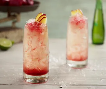 glass of non-alcoholic mocktail with apple slices