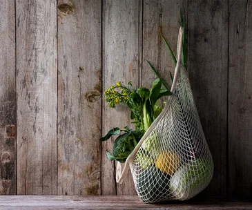 reusable cotton produce bag hanging on wall