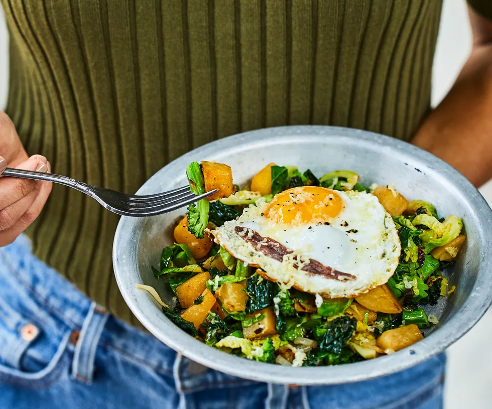 Winter greens with fried egg, anchovy and parmesan