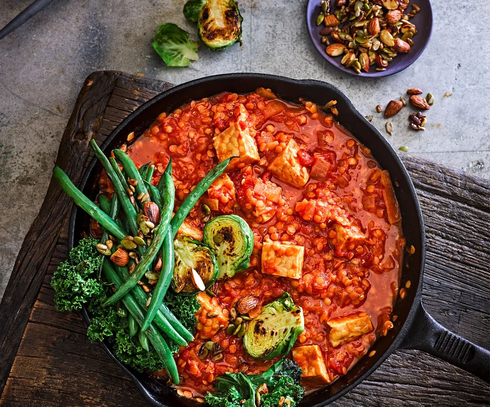 Tempeh and red lentil curry with roasted greens