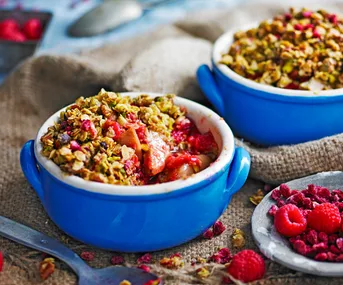 Ginger pear and pistachio crumbles in ramekins