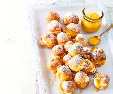 Profiteroles with homemade mango curd