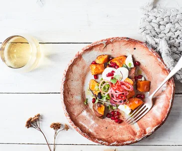Kūmara, pomegranate & goat’s cheese salad with maple & chilli