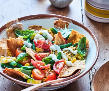 grilled corn salad in bowl on table