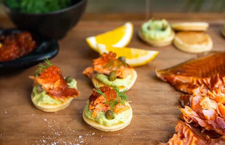 Aoraki Pōhutukawa salmon blinis with avocado cr&egrave;me fra&icirc;che